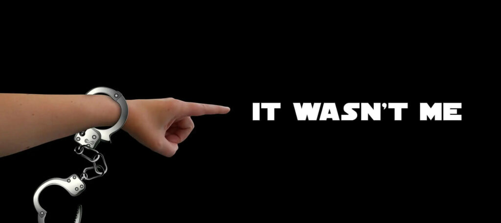 Arm mit offenen Handschellen - Text: "Ich war es nicht"